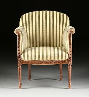 AN ELEGANT LOUIS XVI REVIVAL UPHOLSTERED AND CARVED WALNUT BERGÈRE EN GONDOLE, EARLY 20TH CENTURY, 