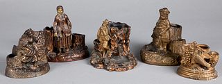 Five figural cigar/match holder and strikers