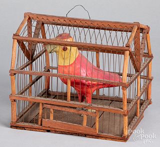 Composition parrot in a wire and wood cage