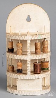 Carved and painted hanging spool sewing caddy