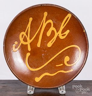 New England slip decorated redware ABC plate