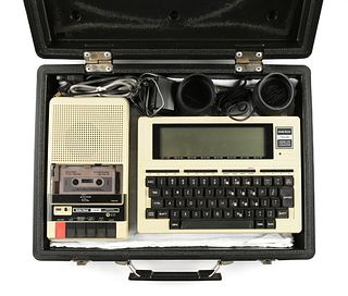 A RADIO SHACK TRS-80 PORTABLE COMPUTER MODEL 100 WITH TRS-80 COMPUTER CASSETTE RECORDER, CIRCA 1983,