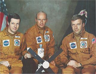 A GROUP OF THREE NASA ASTRONAUT PRINTS AND A PATCH, APOLLO 12, CREW SIGNED, 1969-1973,