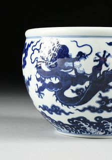 A CHINESE BLUE AND WHITE DRAGON PORCELAIN PLANTER, QIANLONG MARK, QING DYNASTY (1644-1912),