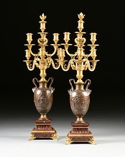A PAIR OF FRENCH NEOCLASSICAL STYLE GILT AND PATINATED BRONZE SEVEN LIGHT CANDELABRA, BY FERDINAND BARBEDIENNE, 19TH CENTURY,