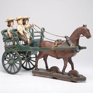 A Folk Art Carving of a Horse-Drawn Buggy with Three Figures