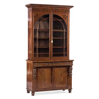 A Federal Carved and Figured Mahogany Bookcase Hutch