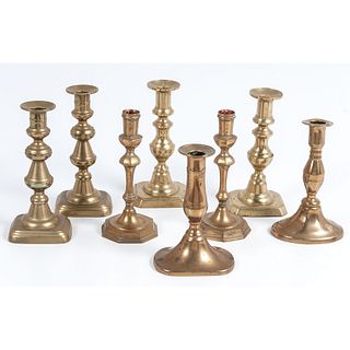 An Assembled Group of Brass Candlesticks