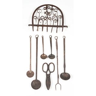 A Hanging Iron Rack and Kitchen Tools