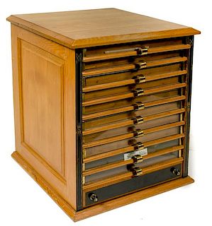 Cartridge Collection Housed in an Oak Spool Cabinet 