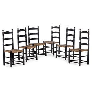 A Set of Six William and Mary Style Black-Painted Rush Seat Ladder-Back Side Chairs