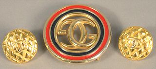 Three piece lot to include two Gucci belt buckles along with pair of earrings.