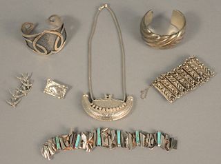 Group of sterling jewelry to include Georg Jensen pin, four bracelets, one large perfume necklace and bird pin.