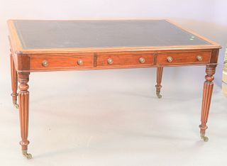 George IV style mahogany partners writing table with leather top on turned and reeded legs having six drawers, ht. 30", top: 39" x 57".