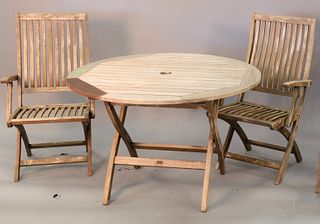Teak three piece set to include two folding chairs and a round table. ht. 28", dia. 43".