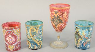 Group of four Moser enameled tumblers and one stem glass, in cranberry and blue glass with enameled flowers, tallest 6 1/4".