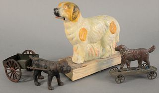 Three dog toys to include tin pull toy, irondog pulling cart, lg. 7" and paper mache dog with squeaker, ht. 6".