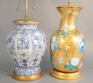 Two contemporary table lamps to include gilt decorated and reverse printed glass lamp with blue floral decoration, ht. 17" along with blue and white p