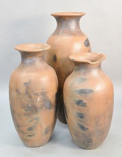 Three outdoor terracotta urns, one with chipped rim, ht. 33", 36 1/2", 47". Estate of Marilyn Ware Strasburg, PA.