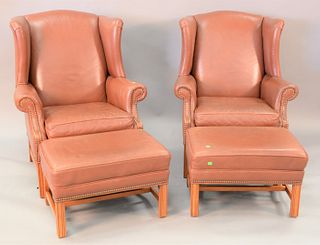 Pair of Ethan Allen leather wing chairs and ottomans (warned and soiled), ht. 42", wd. 30".