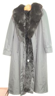 Full length rain coat with fur collar and detachable fur liner.