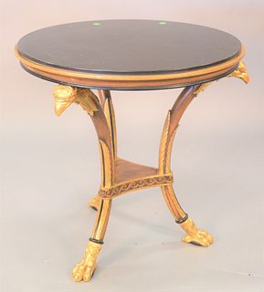 Granite top table with gilt eagle head supports, ht. 28", dia. 28".