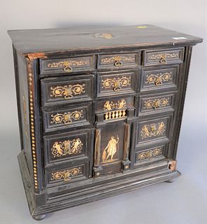 Ebonized desk cabinet with thirteen drawers, bone inlay and ball feet (one foot missing), ht. 21", wd. 21".