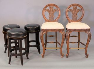 Five bar stools to include three leather upholstered stools along with a pair of tall stools, ht. 28" and 47".