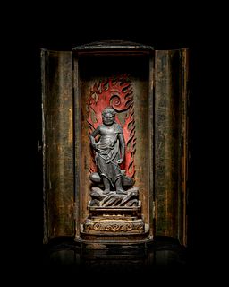 A Black Lacquered Shrine with a Polychrome and Black Painted Wood Figure of a Guardian