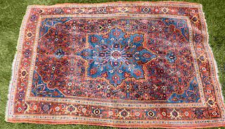 CA. 1900 PERSIAN RUG. BLUE FIELD WITH OVERALL