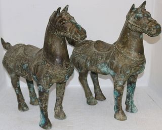 TWO SIMILAR BRONZE CHINESE HORSES. 20TH CENTURY.
