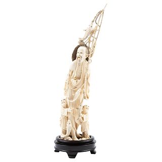Fisherman, China, Ca. 1900. Carved, openwork, inked ivory on a wooden base.