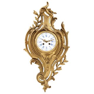 Clock, Early 20th century, In gilt bronze and decorated with plant motifs.
