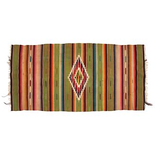 Sarape from Saltillo, Mexico, Ca. 1830. Woven and dyed wool with a stripe pattern and a diamond shape in the center. Probably for a child.