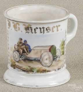 German porcelain occupational shaving mug, 19th c., featuring a hand-painted roadster automobile