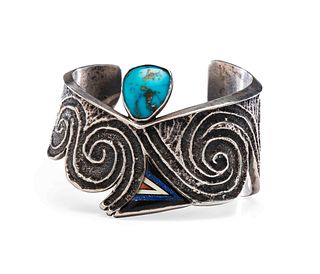 Preston Monongye
(Hopi, 1927-1987)
Tufa Cast Silver Cuff, with Turquoise, Jet, Shell, Coral, and Lapis Inlay Lot is located and will ship from Denver,