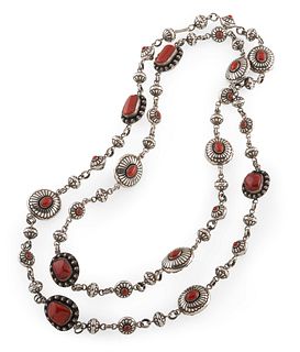 Lee Yazzie
(Dine, b. 1946)
Silver and Coral NecklaceLot is located and will ship from Denver, Colorado