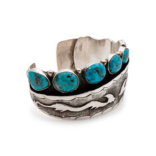 Silver Cuff with Turquoise CabochonsLot is located and will ship from Denver, Colorado
cuff width 1-1/2 inches, interior circumference 6-3/4 inches x 