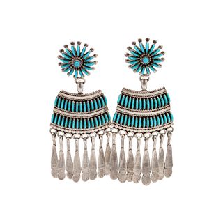 Edith Tsabetsaye
(Zuni, b. 1940)
Silver Earrings, with Petit Point TurquoiseLot is located and will ship from Denver, Colorado.