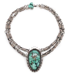 Orville Tsinnie
(Dine, 1943-2017)
Heavy Sterling Silver Necklace, with Turquoise Pendant Lot is located and will ship from Denver, Colorado