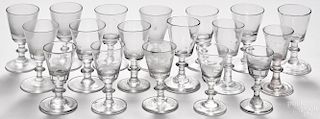 Thirty-five blown glass cordials, 18th/19th c., of similar form with wafer stems.