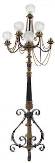 * An Iron and Brass Nine-Light Torchere Height 66 inches.