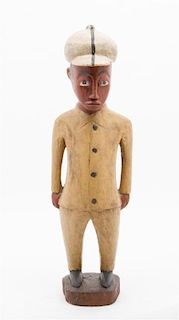 * A Polychrome Wood Figure of a Man Height 18 3/4 inches.