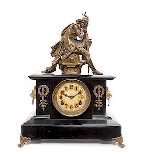 An Empire Style Gilt Metal and Slate Mantel Clock Height of clock 10 3/4 x width 14 5/8 inches.