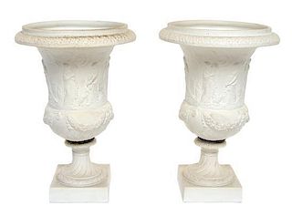 A Pair of Sevres Bisque Porcelain Urns Height 10 1/4 inches.