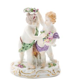 A Meissen Porcelain Figural Group Height 4 7/8 inches.