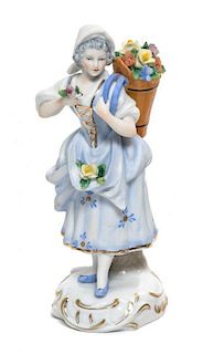 A Sitzendorf Porcelain Figure Height of 5 3/4 inches.