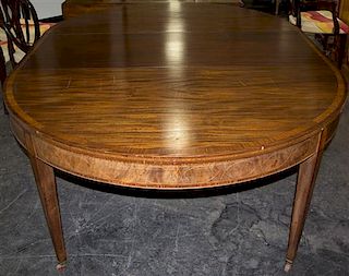 A Mahogany Extension Dining Table Height 29 1/2 x width 104 x depth 60 inches.