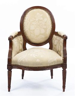 * A Louis XVI Style Walnut Bergere Height 36 inches.