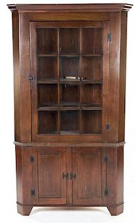 An American Pine Corner Cabinet Height 81 x width 46 1/2 x depth 22 3/4 inches.